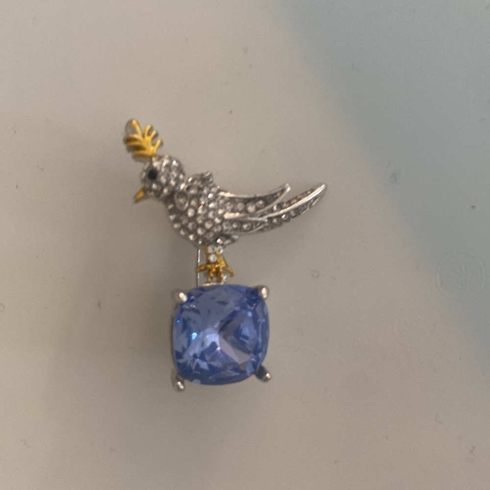 Elegant Silver Bird pin with Blue Stone. Dress up or wear with jeans.